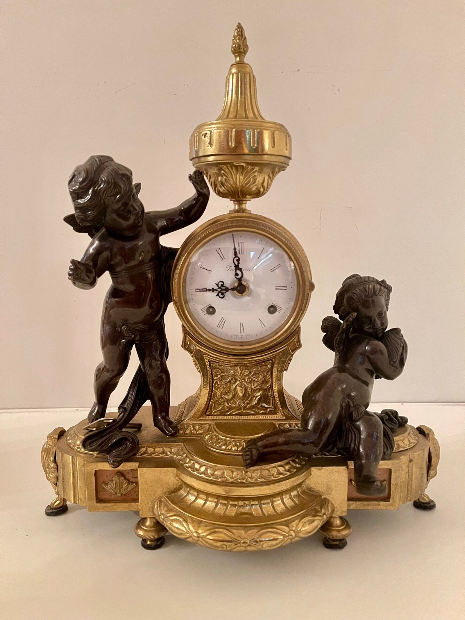 Orologio da caminetto con putti in stile Impero