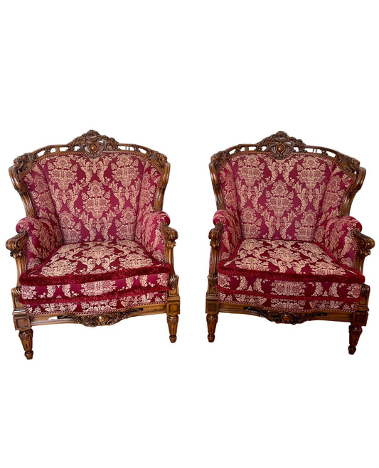Coppia di poltrone barocche intagliate in legno dorato