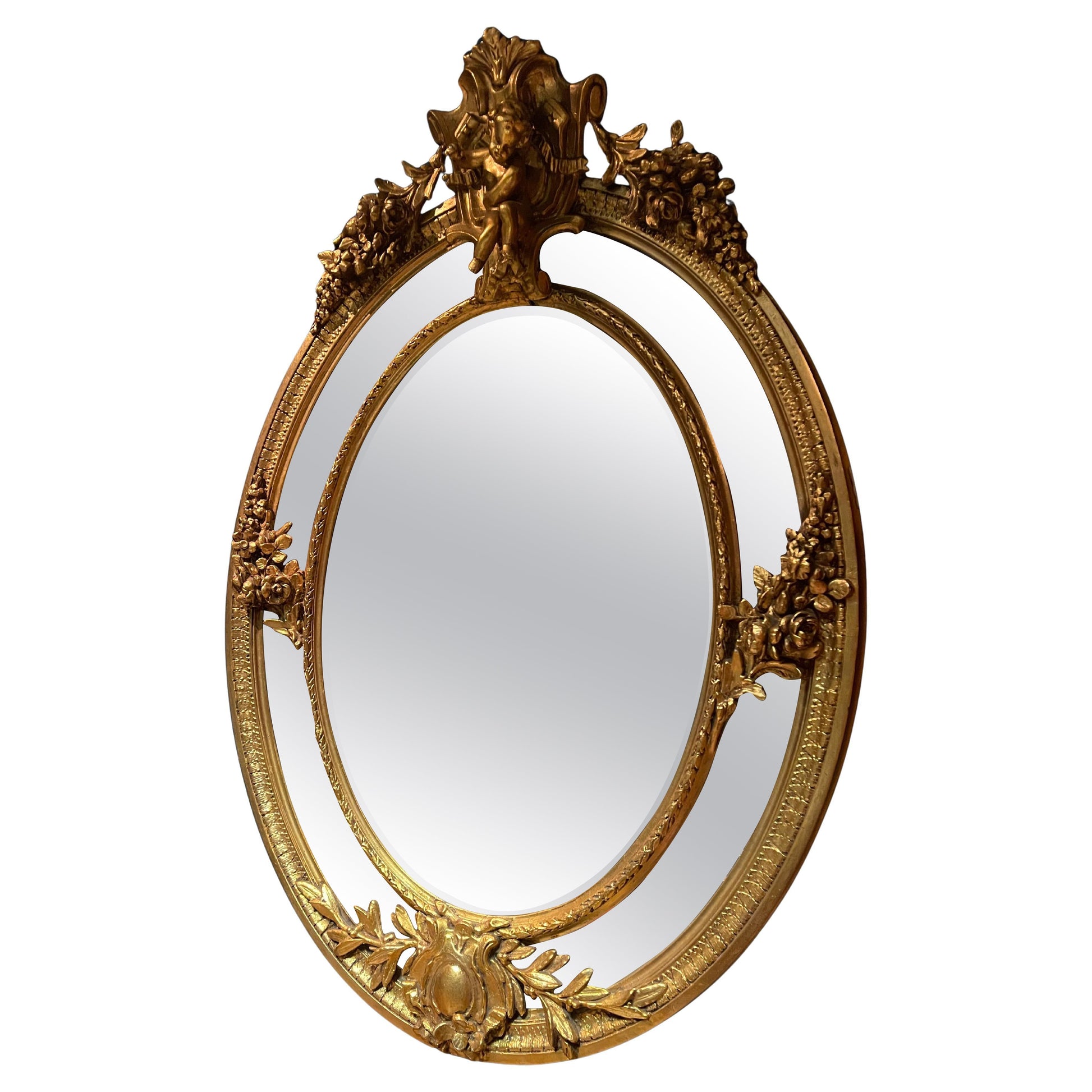 Antica specchiera dorata francese in foglia di oro del 800