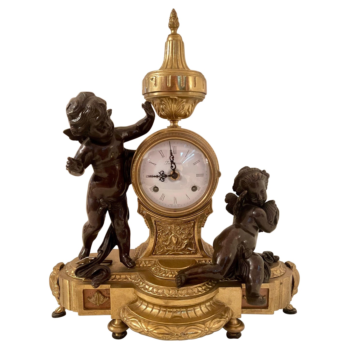 Orologio classico italiano meccanico in bronzo con due putti anni '70