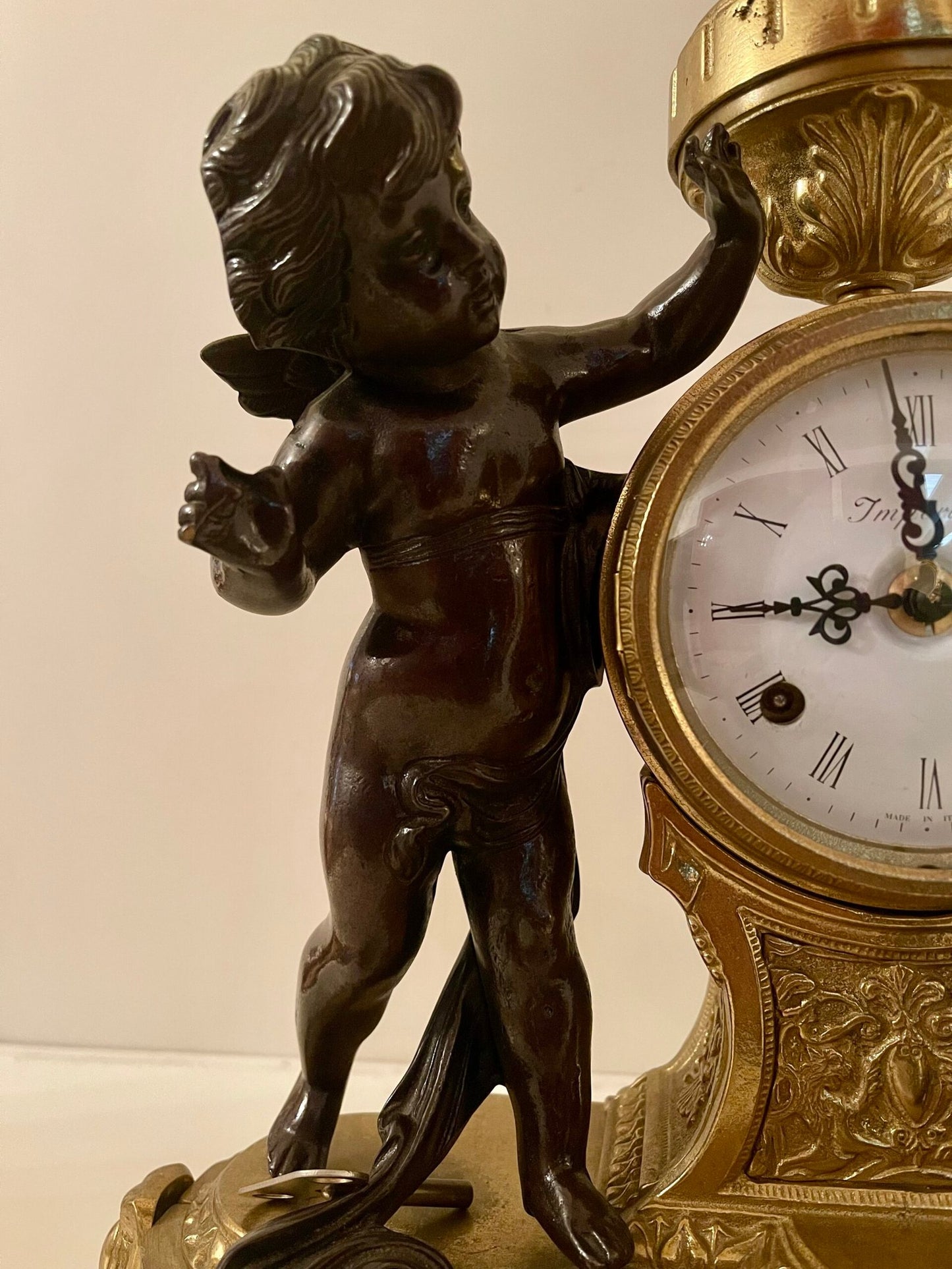 Orologio da caminetto con putti in stile Impero
