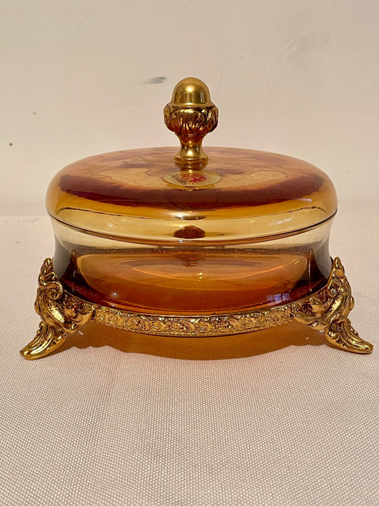 Scatola Decorativa Rotonda in Cristallo Ambra con Dettagli Dorati – Desjardins Paris
