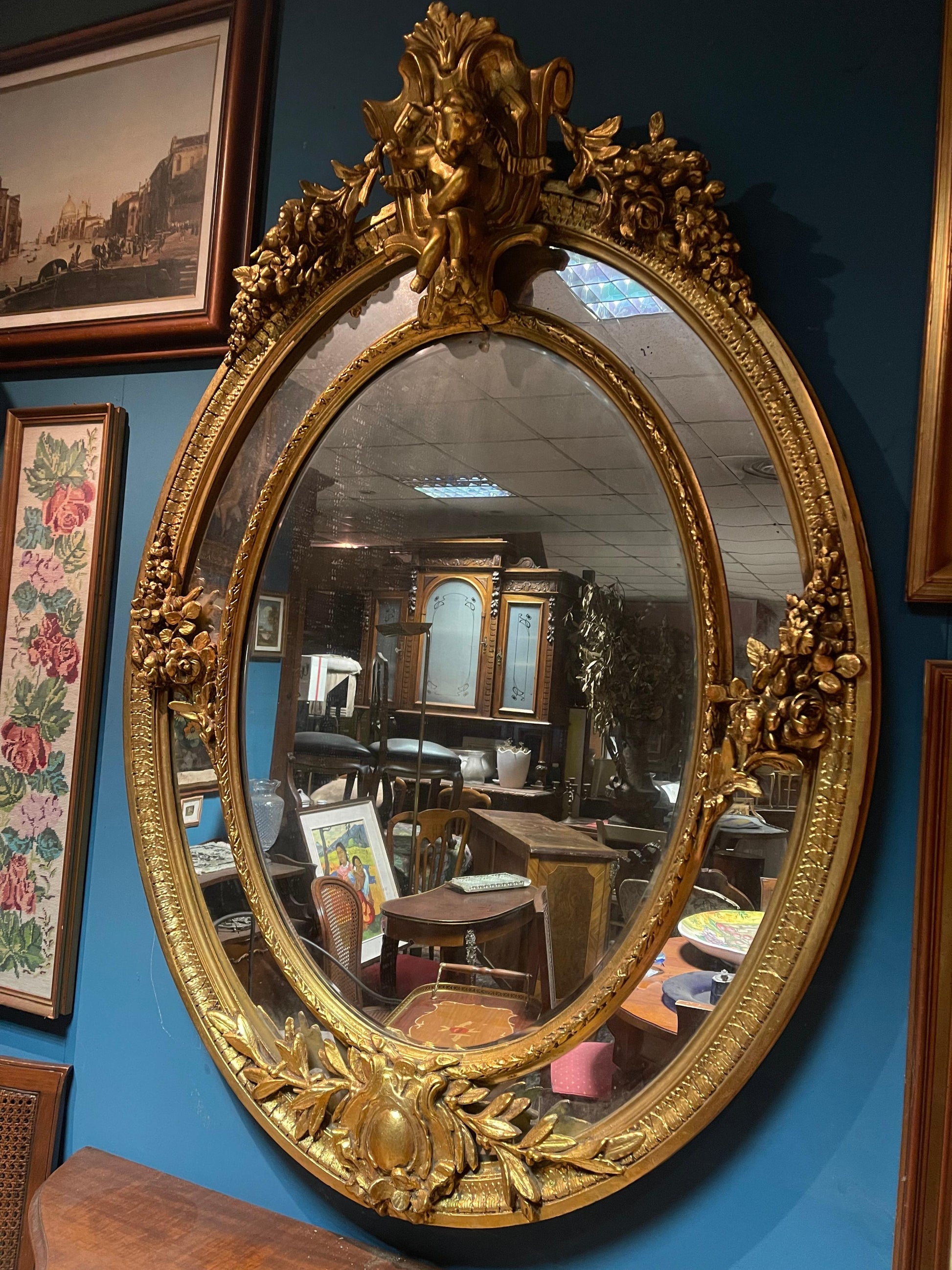 Antica specchiera dorata francese in foglia di oro del 800