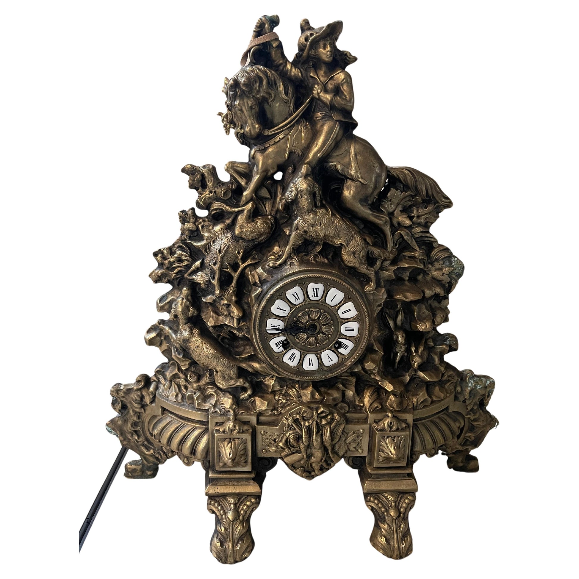 Orologio in bronzo raffigurante moschettiere con cavallo e cane