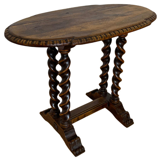 Tavolino in legno tornito con piano ovale intagliato, Italia, anni '40.